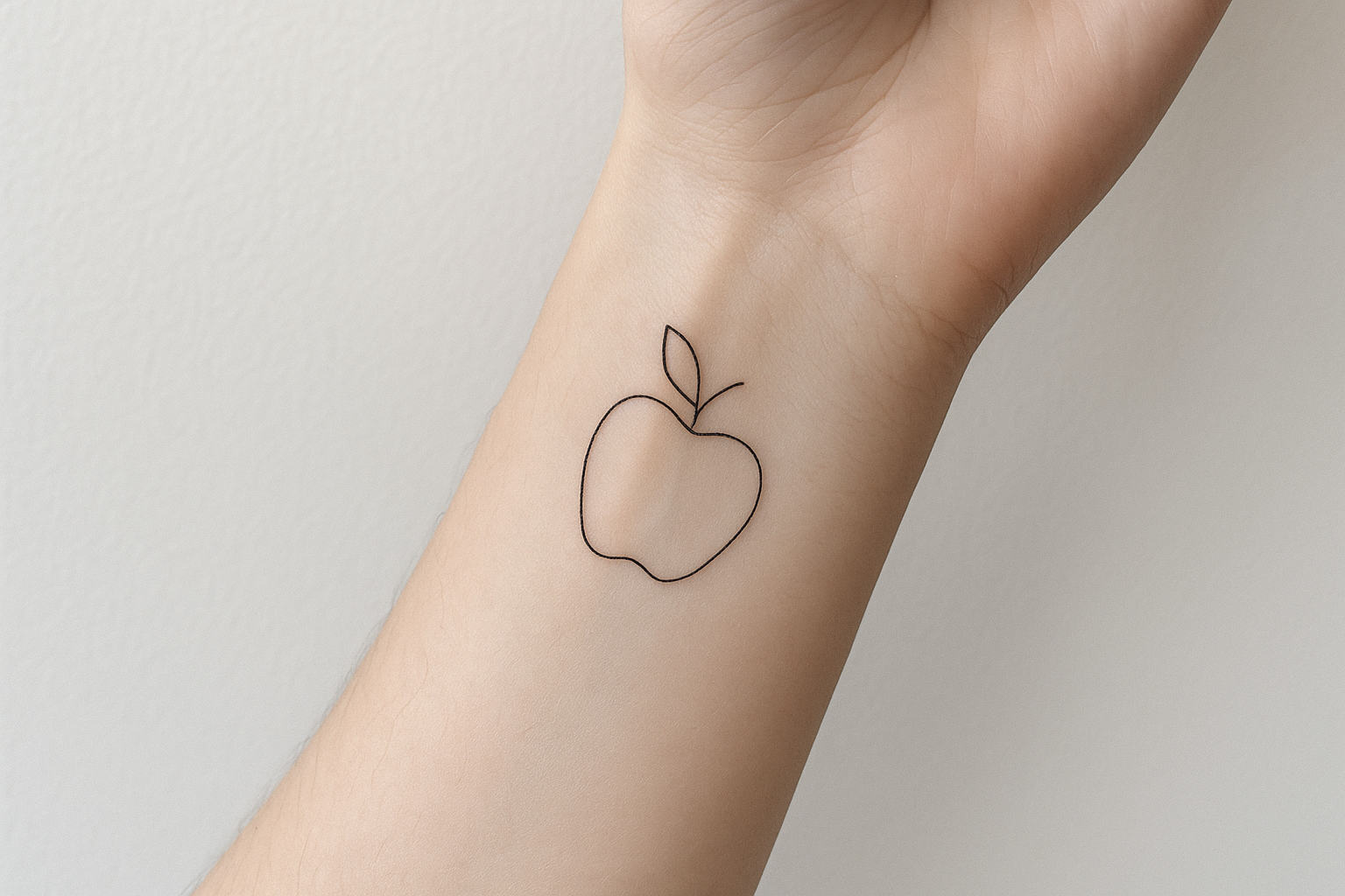 Single-line apple tattoo outline